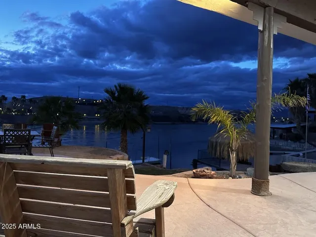 a view of swimming pool with a patio and a yard