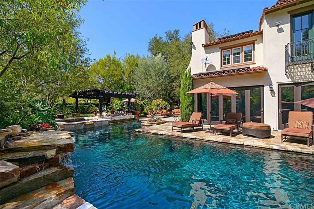 24 View Terrace Irvine, CA 92603 - Photo 1 of 1 a view of a patio with table and chairs and potted plants