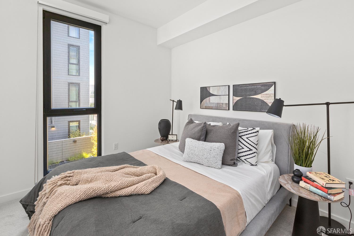 988 Harrison Street, Unit CJ3 San Francisco, CA 94107 - Photo 2 of 9 a bedroom with a bed and a closet