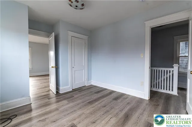 wooden floor in a hall with an entryway