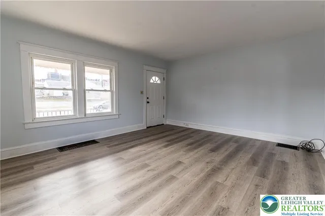 an empty room with windows