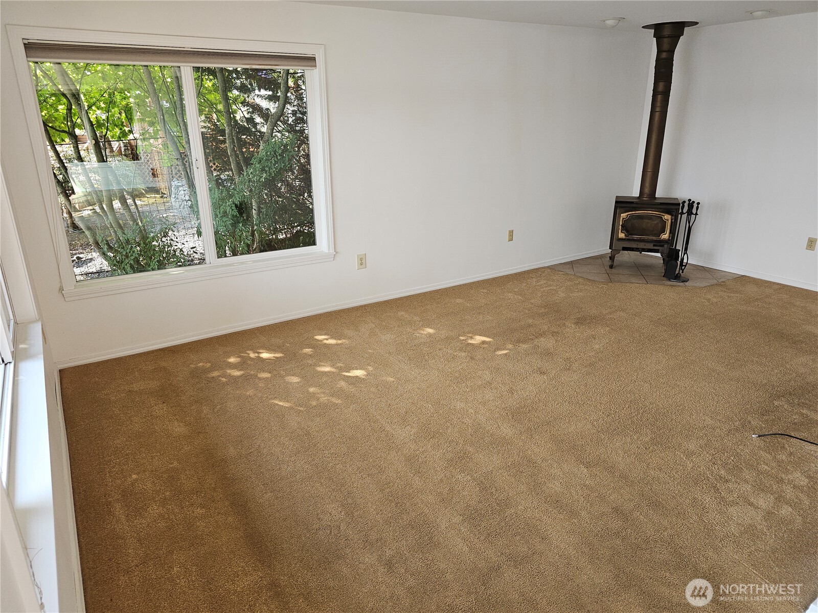 70 East Sund Road Grapeview, WA 98546 - Photo 16 of 36 a view of an empty room with a window