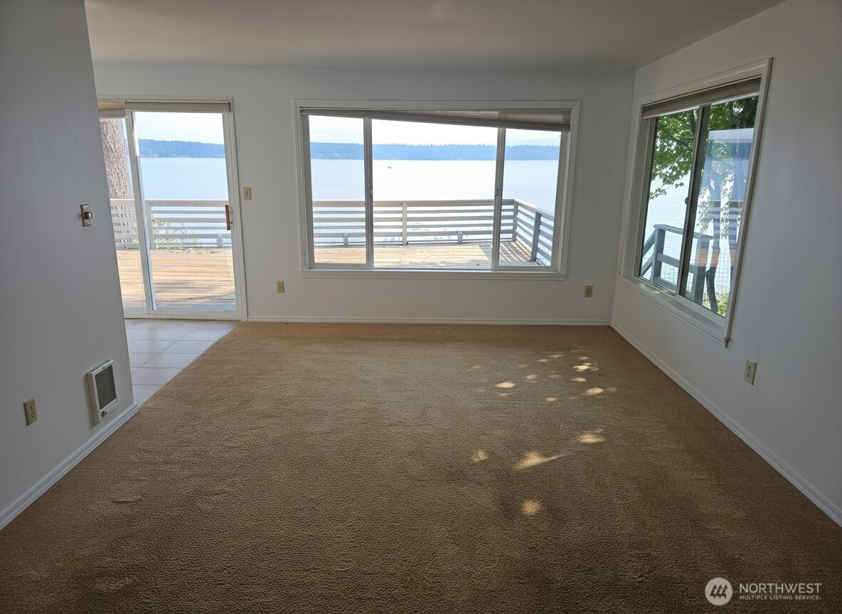 70 East Sund Road Grapeview, WA 98546 - Photo 17 of 36 a view of an empty room with a window