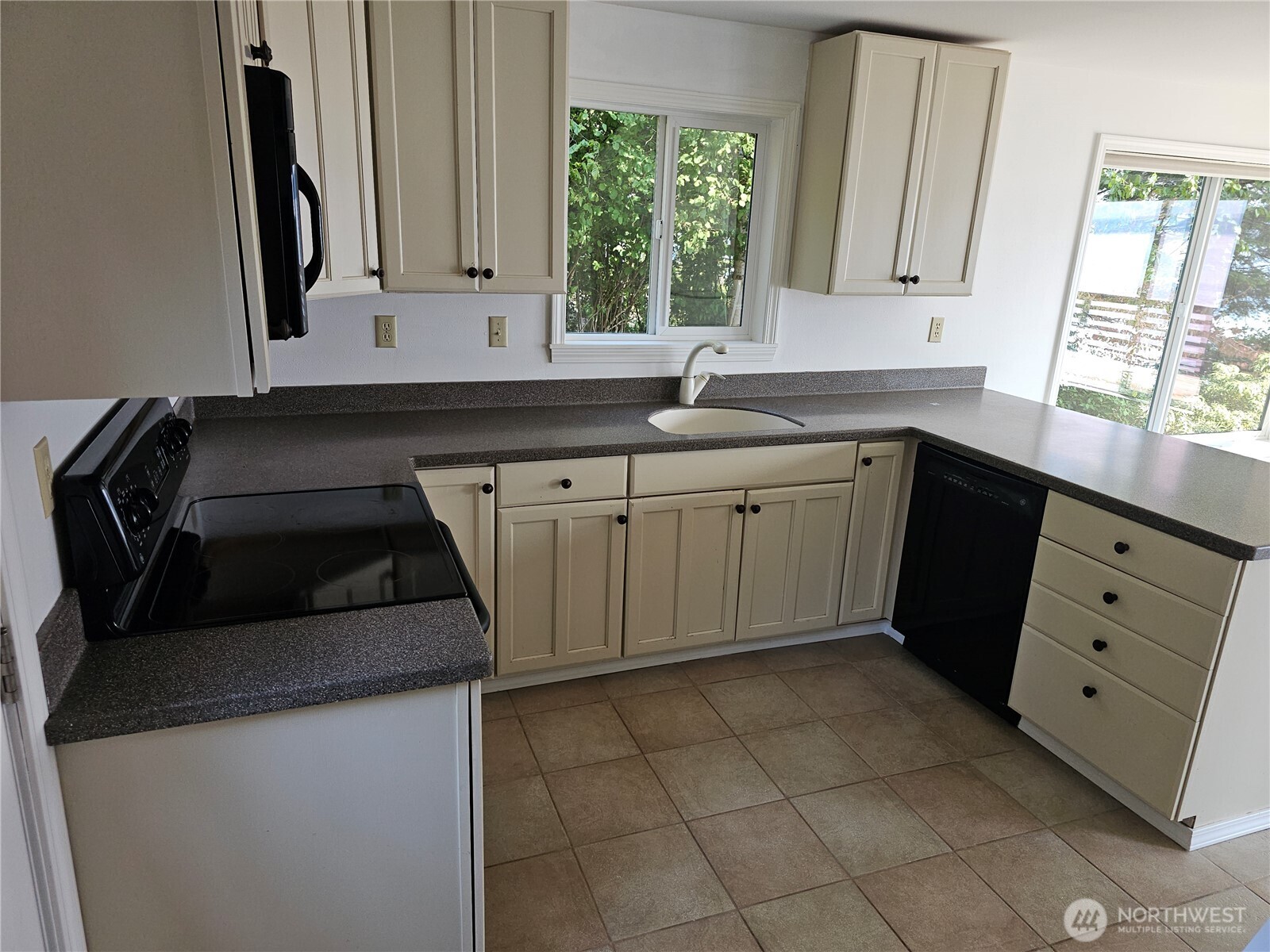 70 East Sund Road Grapeview, WA 98546 - Photo 18 of 36 a kitchen with a sink and cabinets