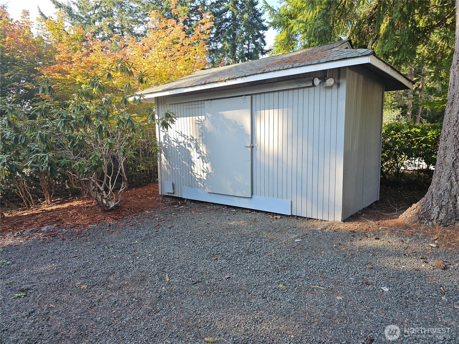 70 East Sund Road Grapeview, WA 98546 - Photo 27 of 36 a backyard of a house with lots of green space