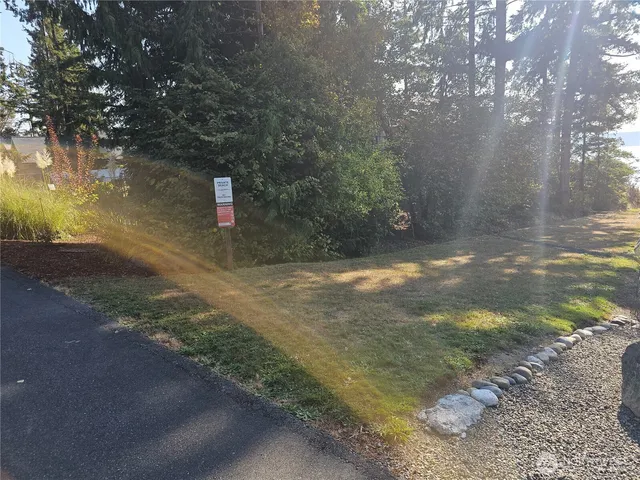 a view of a bench in wooden floor