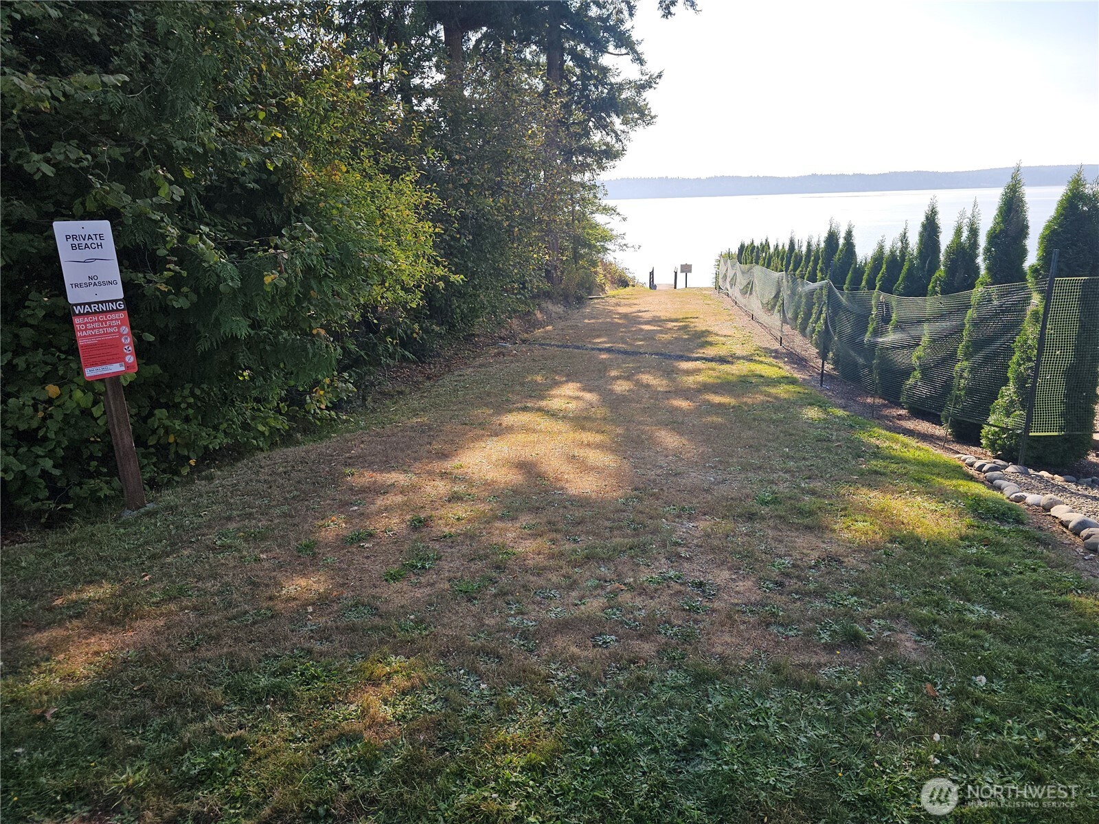 70 East Sund Road Grapeview, WA 98546 - Photo 30 of 36 a backyard of a house with lots of green space