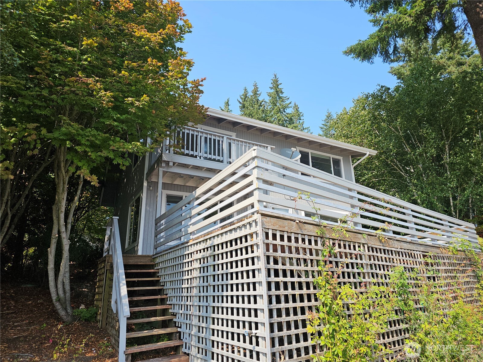 70 East Sund Road Grapeview, WA 98546 - Photo 3 of 36 a view of a balcony with wooden floor and fence