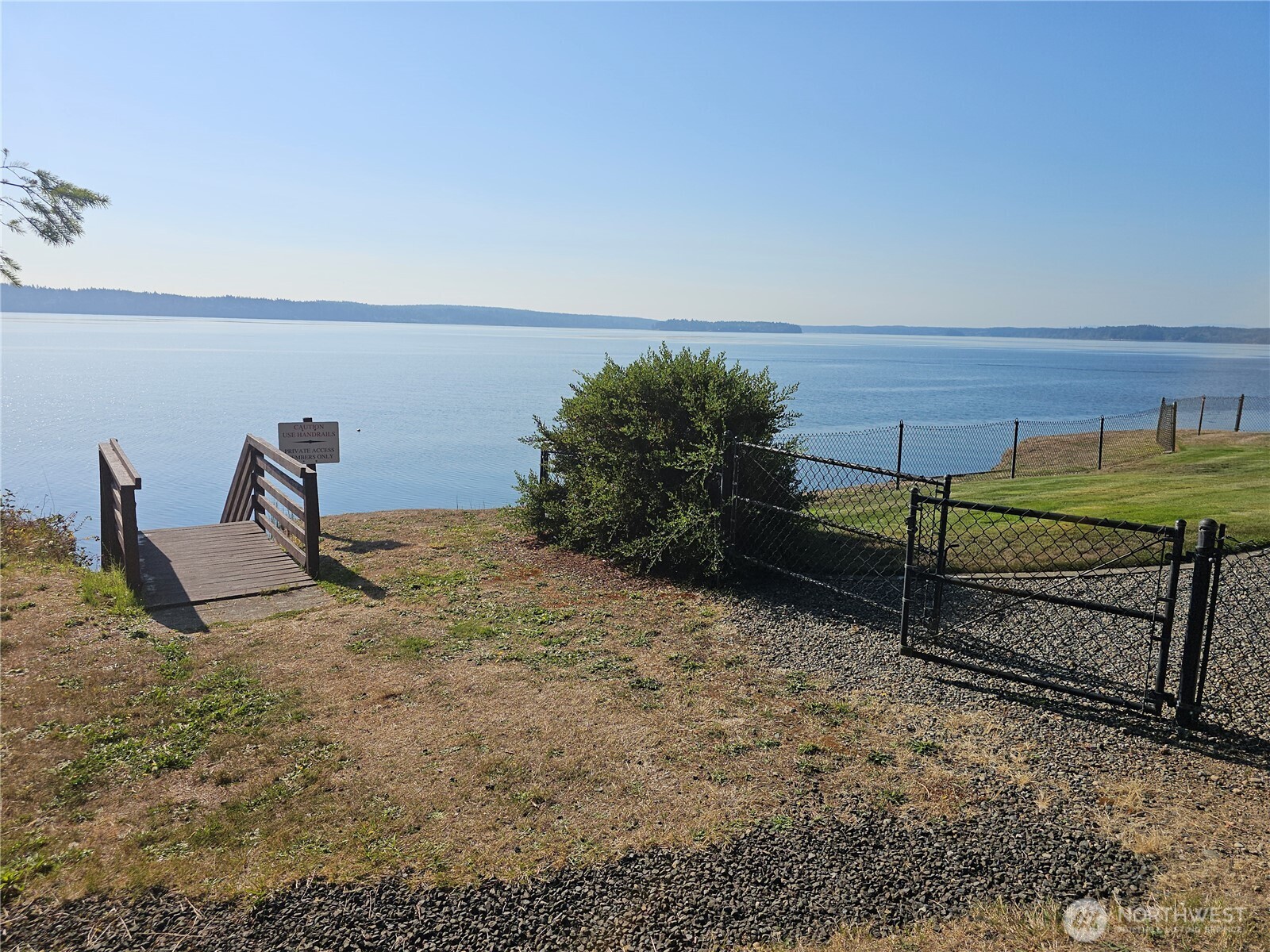 70 East Sund Road Grapeview, WA 98546 - Photo 31 of 36 a view of a bench in wooden floor