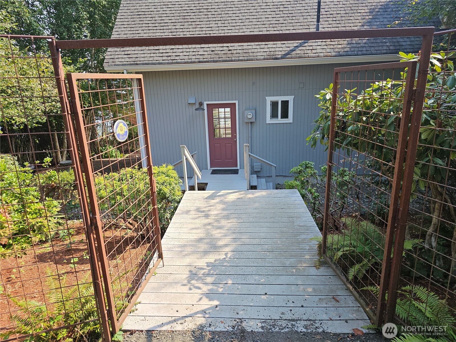 70 East Sund Road Grapeview, WA 98546 - Photo 5 of 36 a front view of a house with garden
