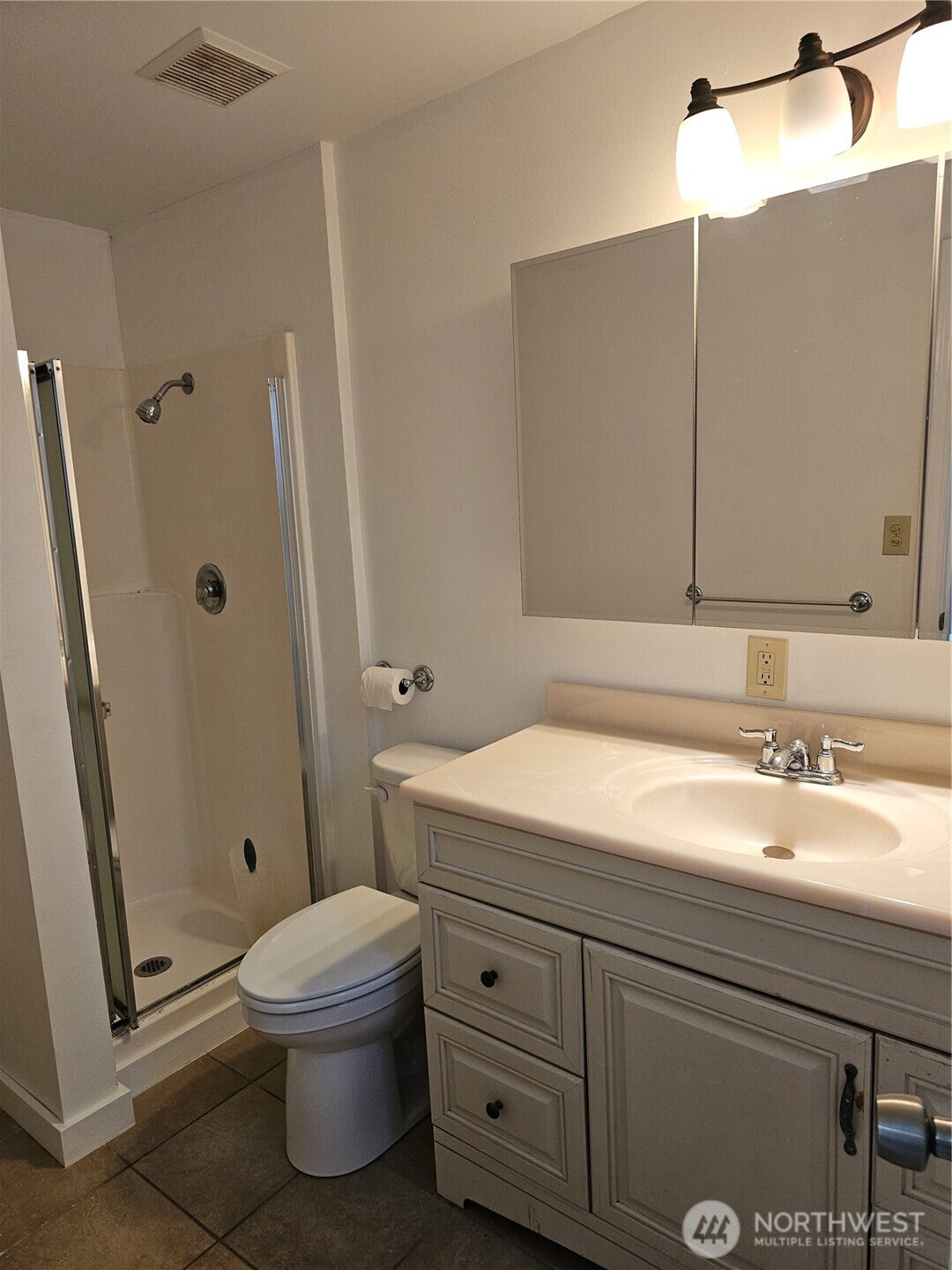 70 East Sund Road Grapeview, WA 98546 - Photo 10 of 36 a bathroom with a sink a mirror and a toilet