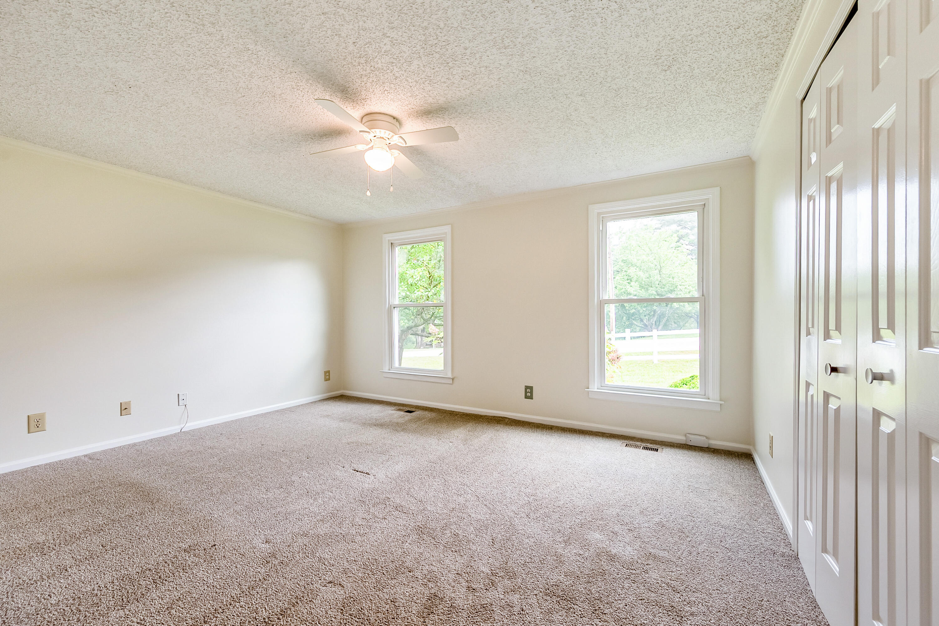 281 Penn Road Northwest Floyd, VA 24091 - Photo 20 of 49 an empty room with windows and fan