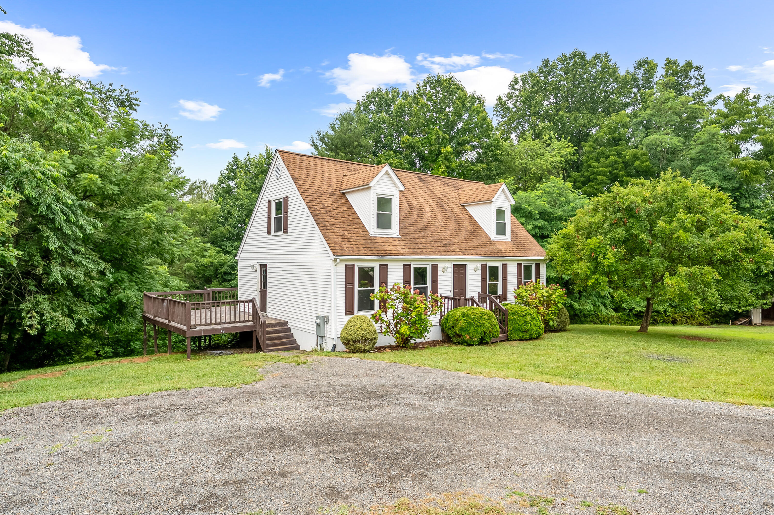 281 Penn Road Northwest Floyd, VA 24091 - Photo 4 of 49 a front view of a house with a garden and yard