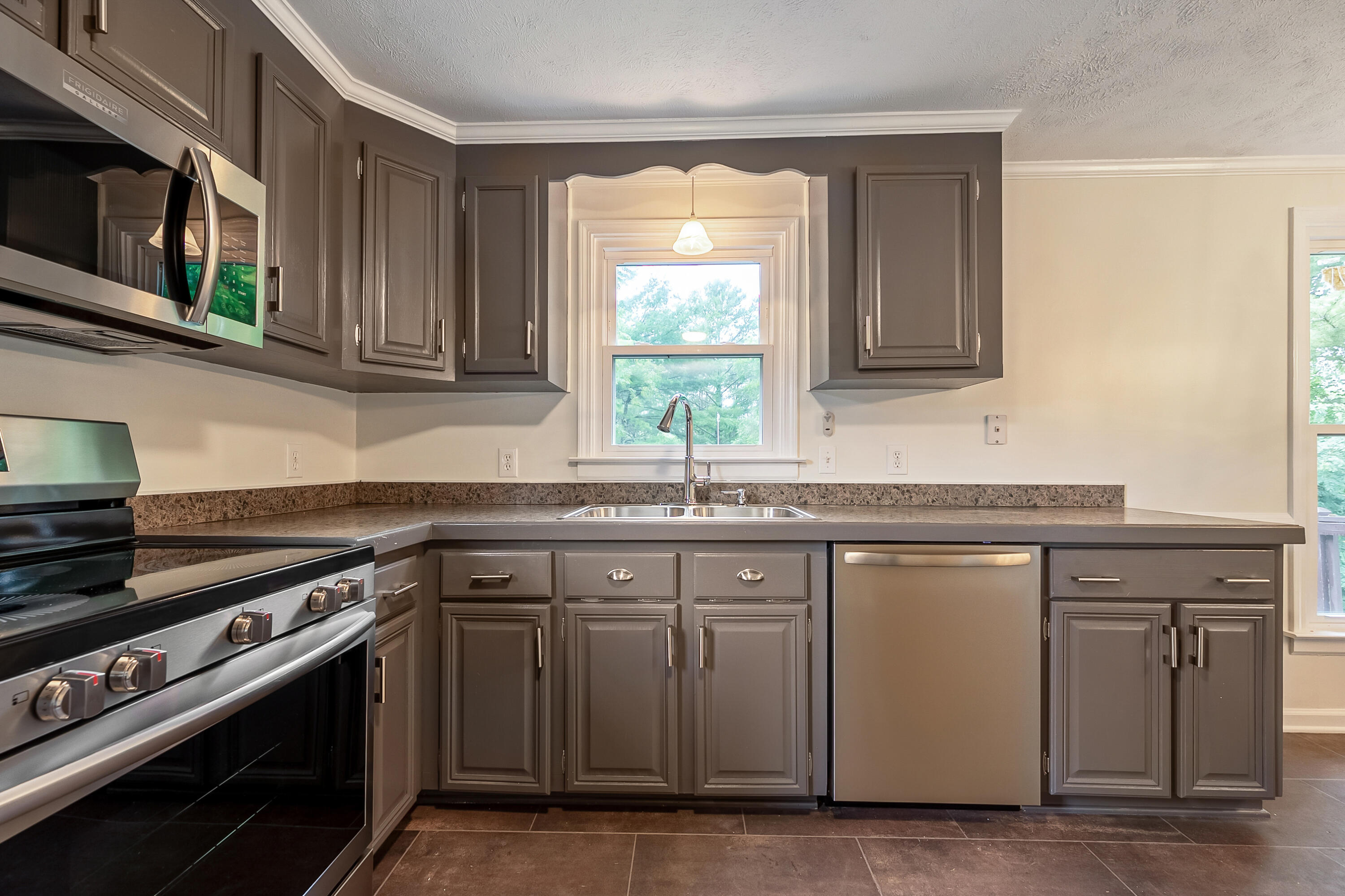 281 Penn Road Northwest Floyd, VA 24091 - Photo 6 of 49 a kitchen with stainless steel appliances granite countertop a sink and a stove