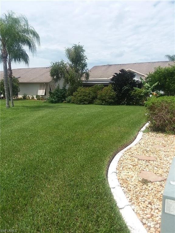 13250 Heather Ridge Loop Fort Myers, FL 33966 - Photo 6 of 35 LEFT ELEVATION/ SIDE YARD