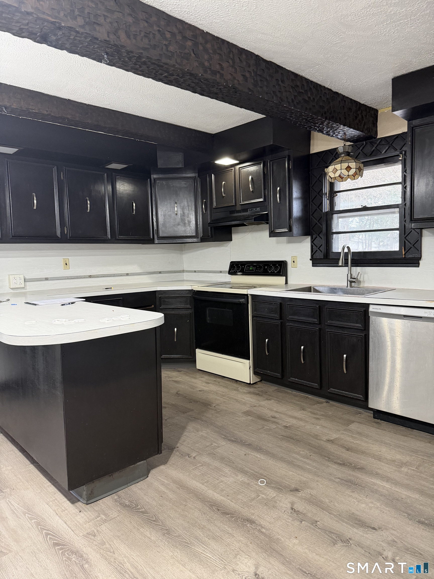 16 St Lawrence Street Manchester, CT 06040 - Photo 1 of 6 a kitchen with stainless steel appliances granite countertop a stove a sink and a microwave