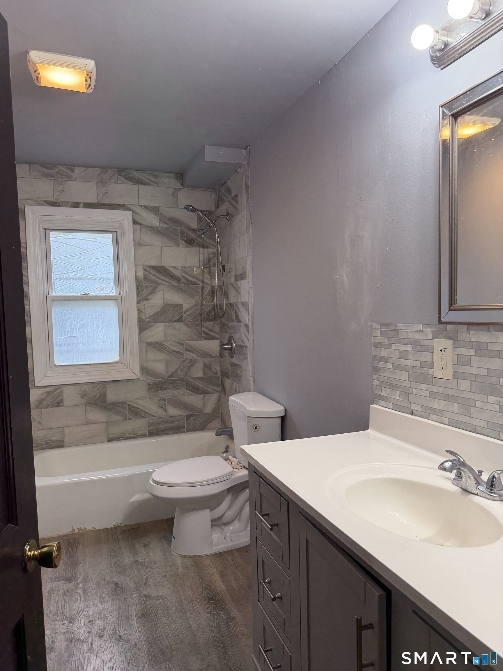 16 St Lawrence Street Manchester, CT 06040 - Photo 2 of 6 a bathroom with a sink a toilet and shower