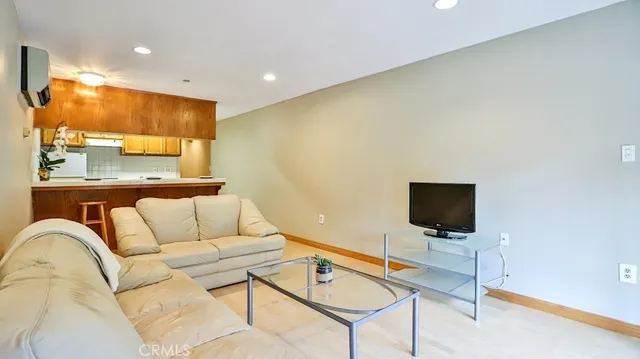a living room with a couch and a flat screen tv