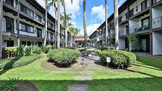 a view of an apartment with a garden and plants