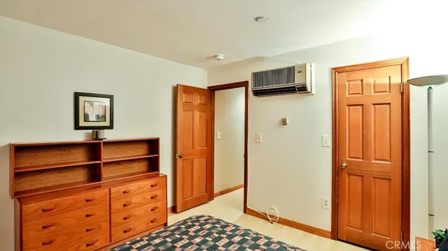 a view of walk in closet with wooden floor