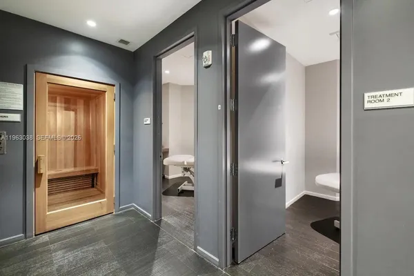 a view of a room with wooden walls