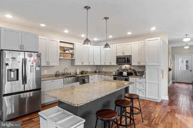 a bedroom with a bed and a ceiling fan