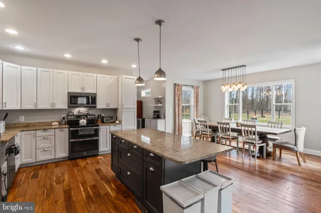 a bedroom with a bed and a tv