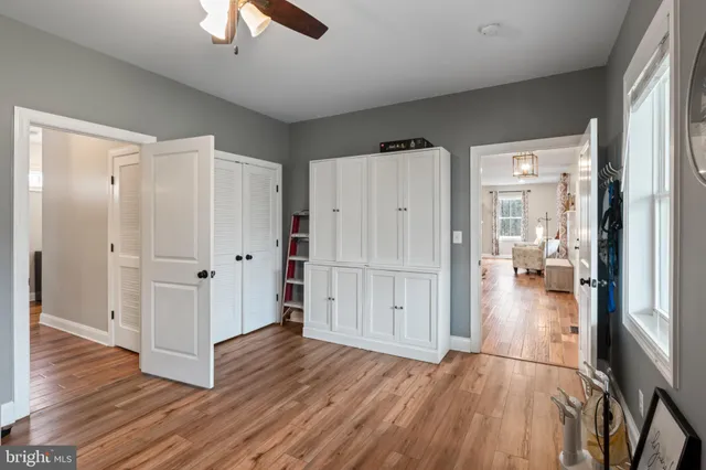 a bedroom with a bed furniture and a chandelier