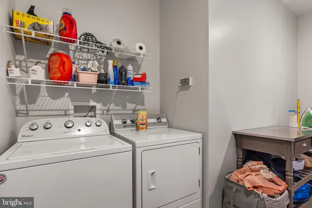 a view of a chairs and table in the back yard of the house