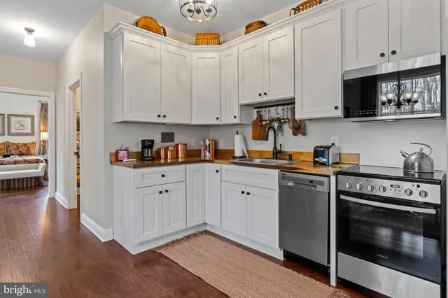a view of a lake with a yard and mountain view