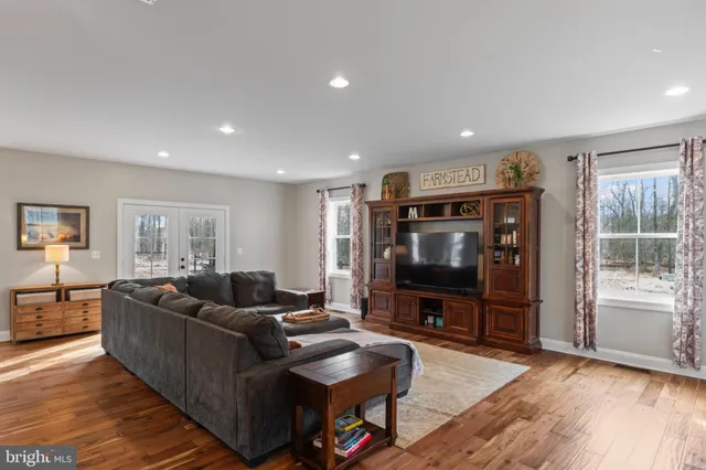 a kitchen with stainless steel appliances granite countertop white cabinets a sink and dishwasher