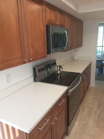 a kitchen with a sink and a microwave