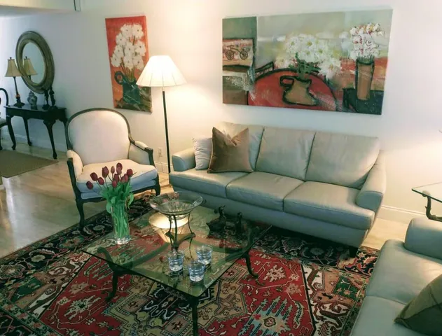 a living room with furniture and a lamp