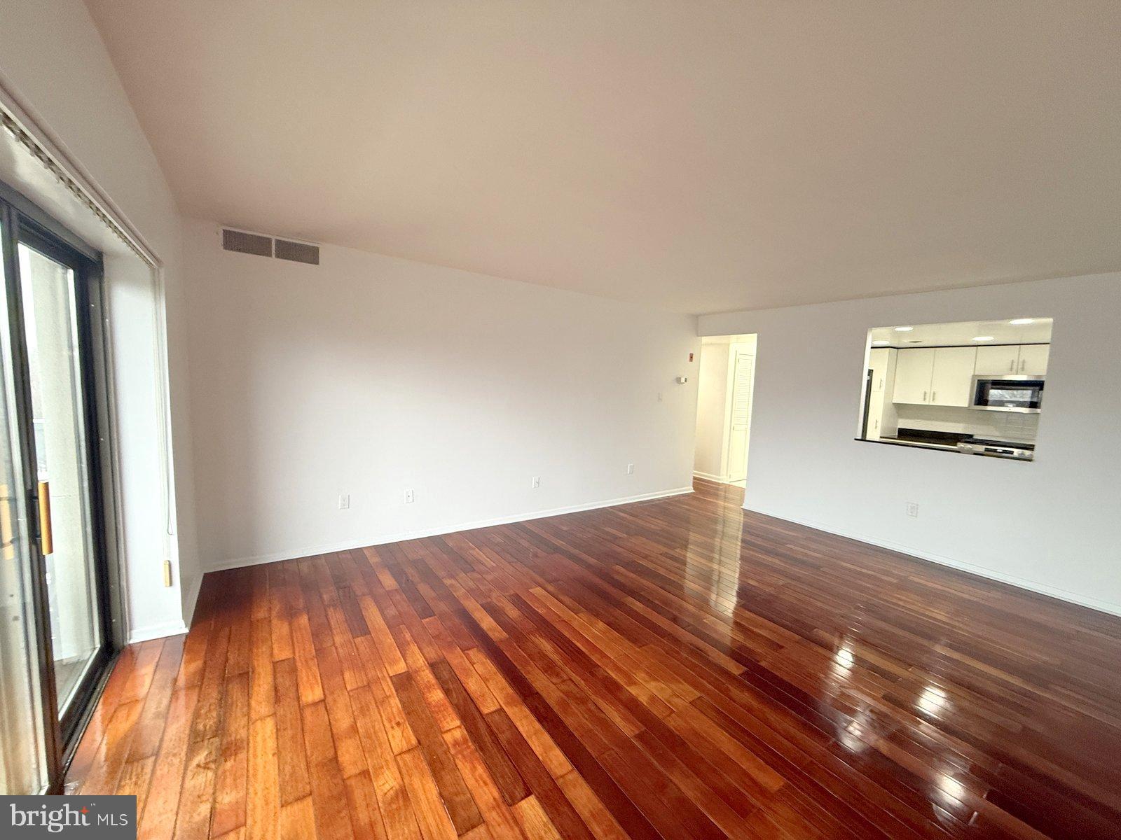 606 Cooper Landing Road, Unit B6F Cherry Hill, NJ 08002 - Photo 7 of 11 a view of a room with wooden floor and a window