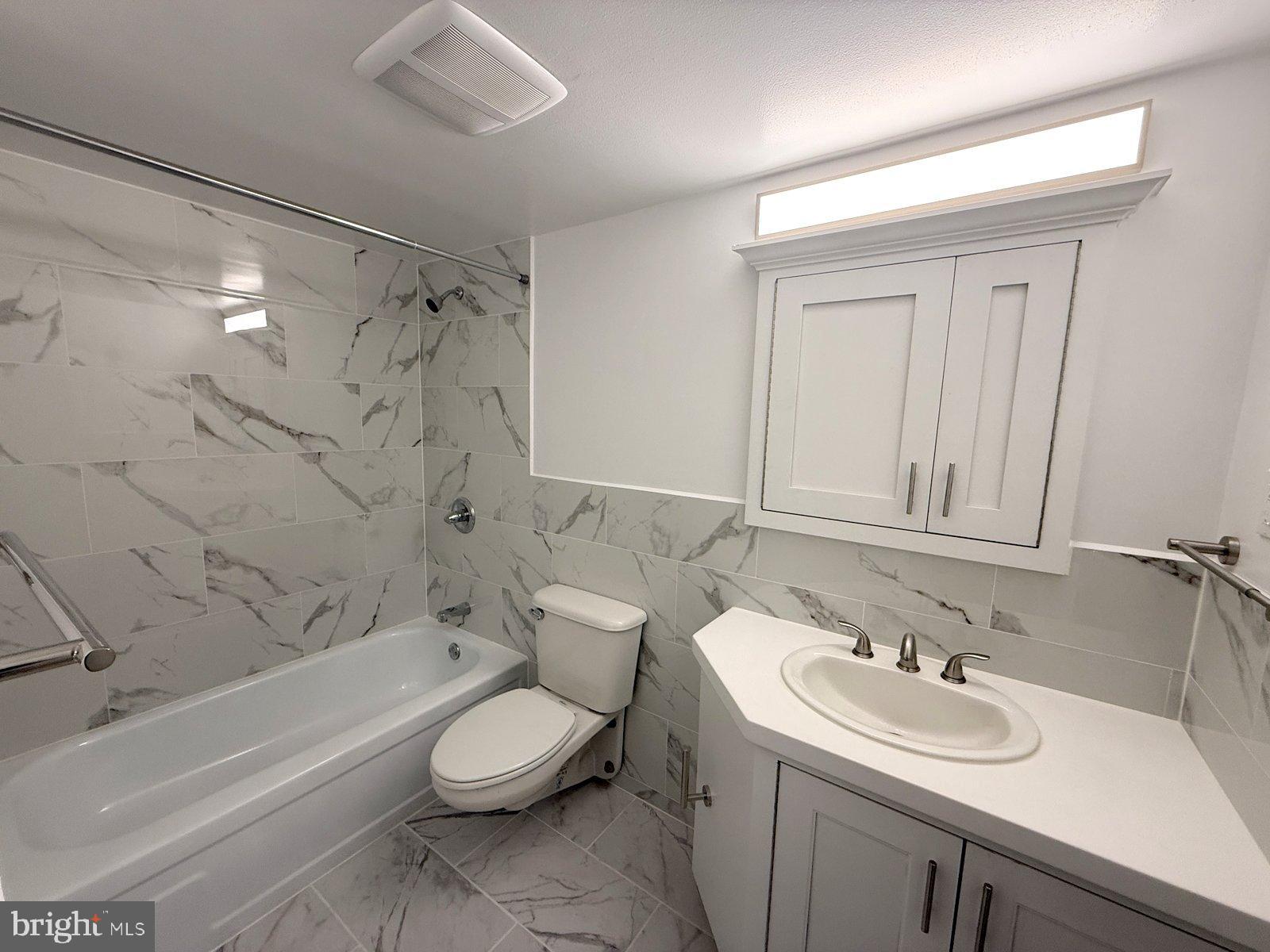 606 Cooper Landing Road, Unit B6F Cherry Hill, NJ 08002 - Photo 10 of 11 a bathroom with a sink toilet vanity and shower
