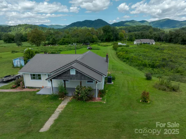a aerial view of a house with a big yard