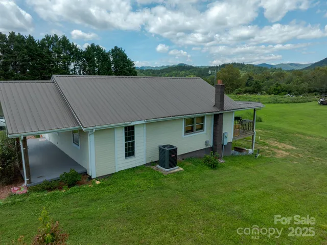 a aerial view of a house with yard and a garden