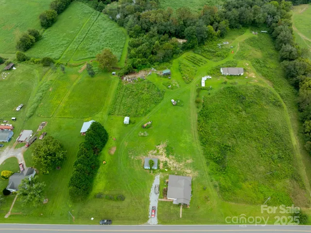 a backyard of a house with lots of green space