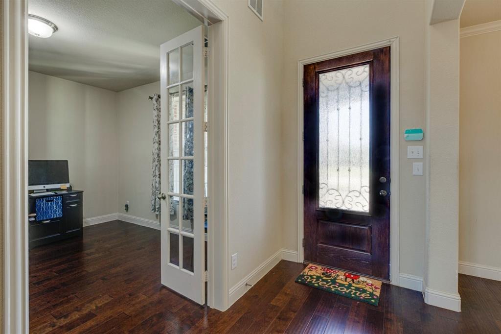 336 Red Hill Road Sunnyvale, TX 75182 - Photo 4 of 36 a room with wooden floor and furniture