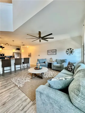 a bed room with a bed and a chandelier