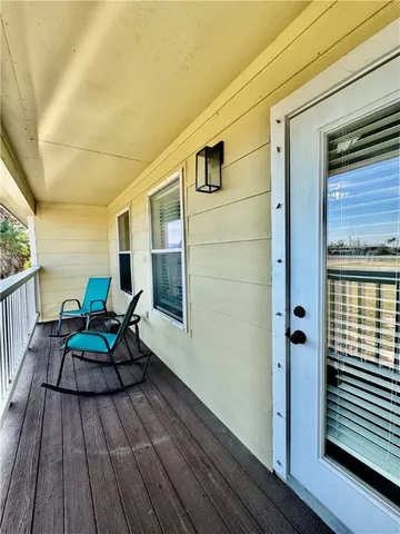 a bathroom with a granite countertop double vanity sink and a mirror