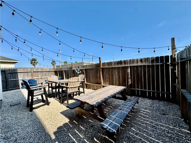 a view of a chairs and table in a patio