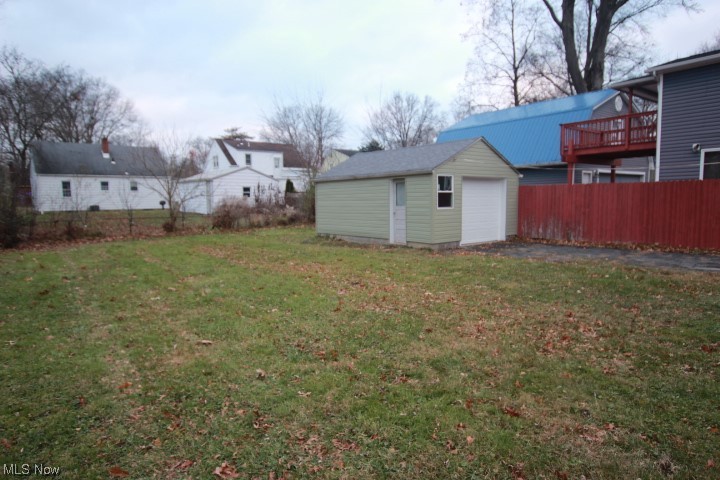3606 Shelby Road Youngstown, OH 44511 - Photo 22 of 33 View of yard featuring a garage and a wooden deck