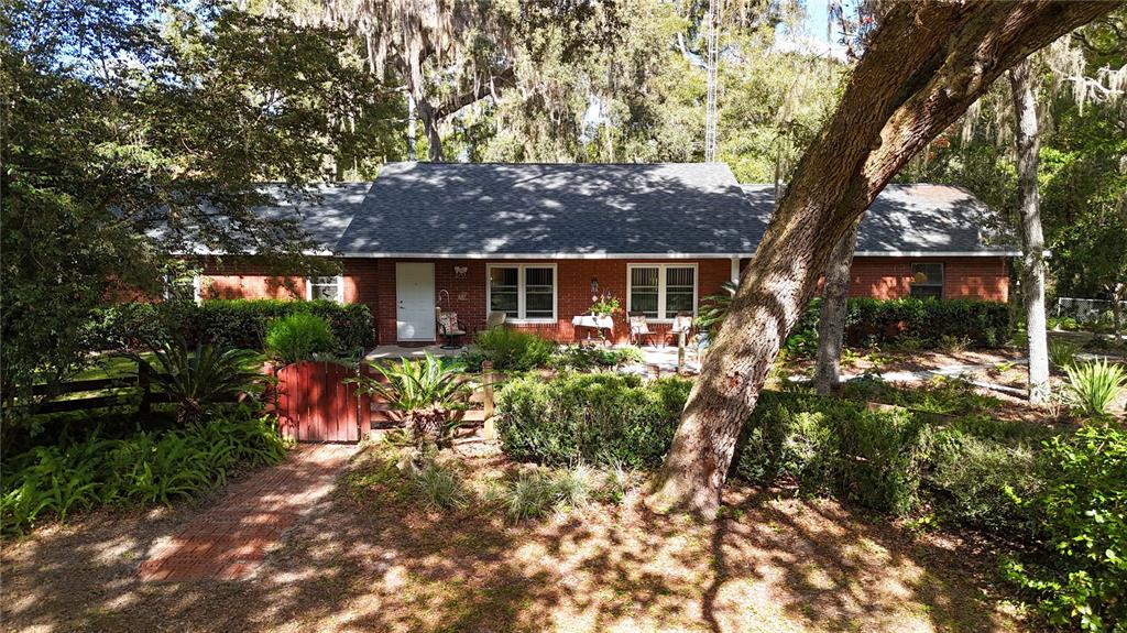 11440 Southwest Archer Road Gainesville, FL 32608 - Photo 1 of 44 a view of house with outdoor seating