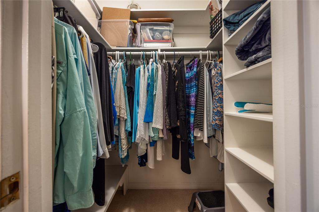 11440 Southwest Archer Road Gainesville, FL 32608 - Photo 11 of 44 a view of walk in closet with clothes and shoes