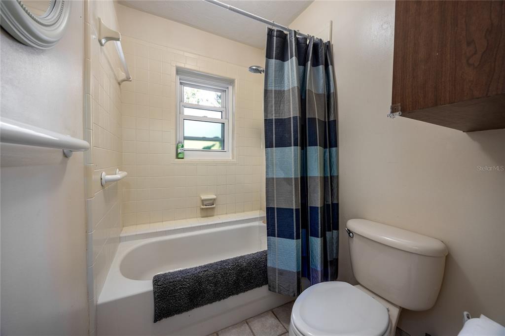 11440 Southwest Archer Road Gainesville, FL 32608 - Photo 14 of 44 a bathroom with a toilet and a shower