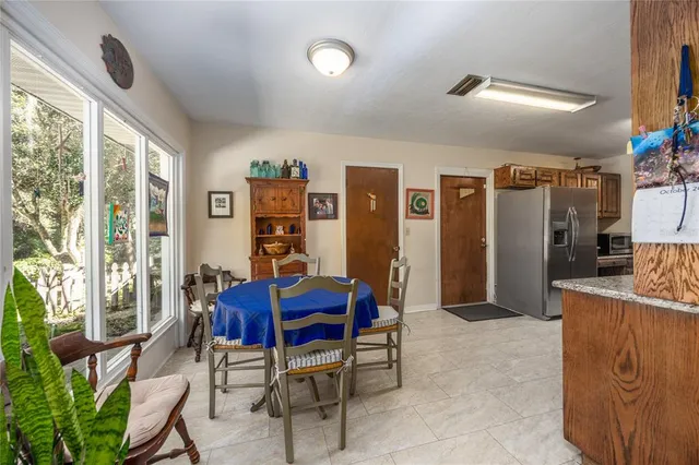 a view of a dining room with furniture window and outside view