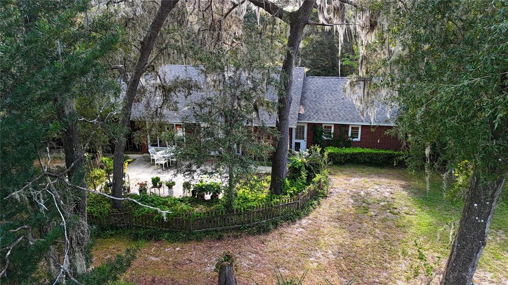 11440 Southwest Archer Road Gainesville, FL 32608 - Photo 28 of 44 a view of a garden with large trees