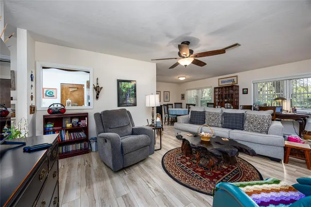 a living room with furniture or couch and a wooden floor