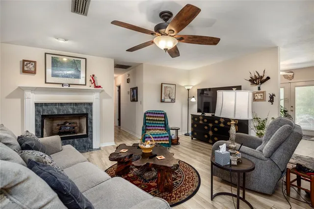a living room with furniture and a fireplace